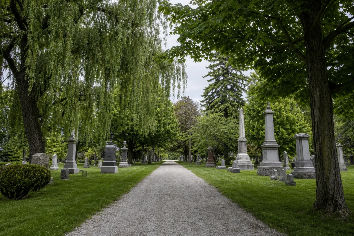 A tree-lined path through a historic Ontario cemetery.